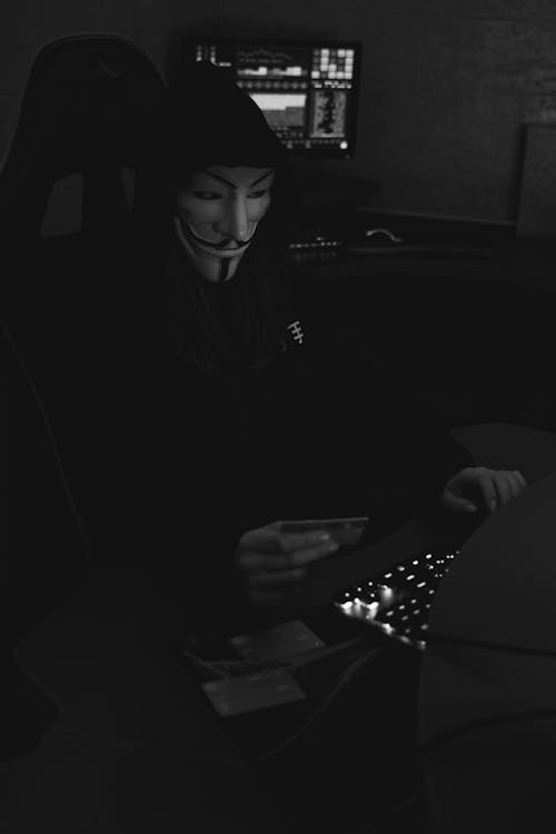 Free Grayscale Photo of a Person Wearing Guy Fawkes Mask Stock Photo