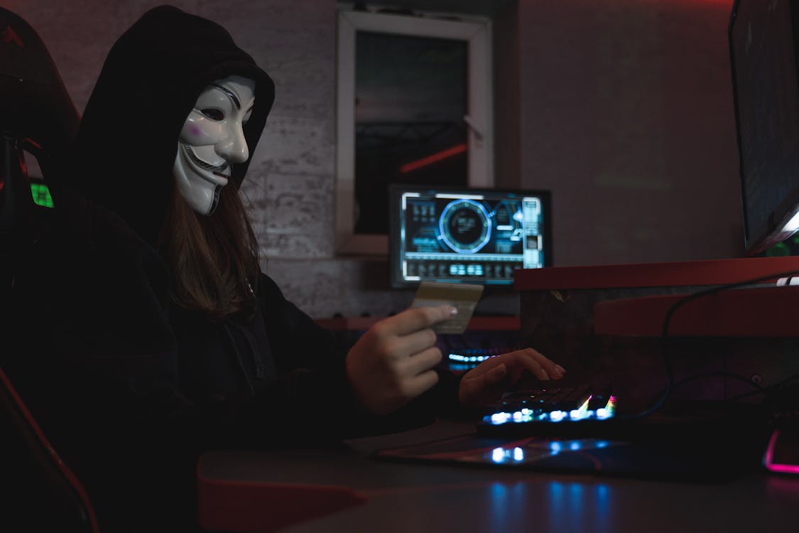 Free Woman in Black Hoodie Holding a Bank Card Stock Photo