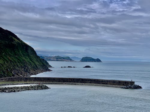 Scenery of a Bay under Cloudy Sky