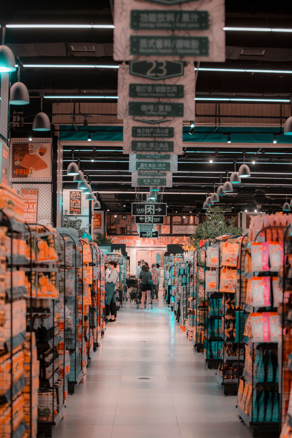 Bustling supermarket aisle with shoppers and stocked shelves