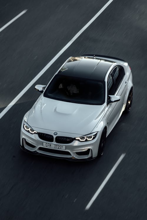 White BMW M3 Driving on the Road