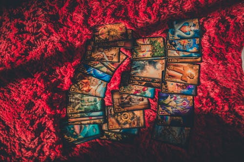 Tarot Cards Laid out on Red Fabric