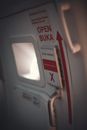 Airplane door with arrow and small illuminator