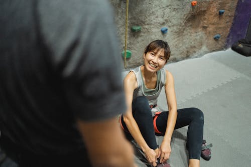 Free Happy woman listening coach during climbing training Stock Photo