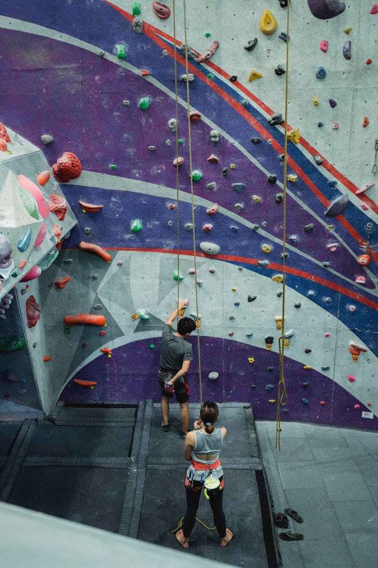 Unrecognizable Climbers Preparing For Training Together