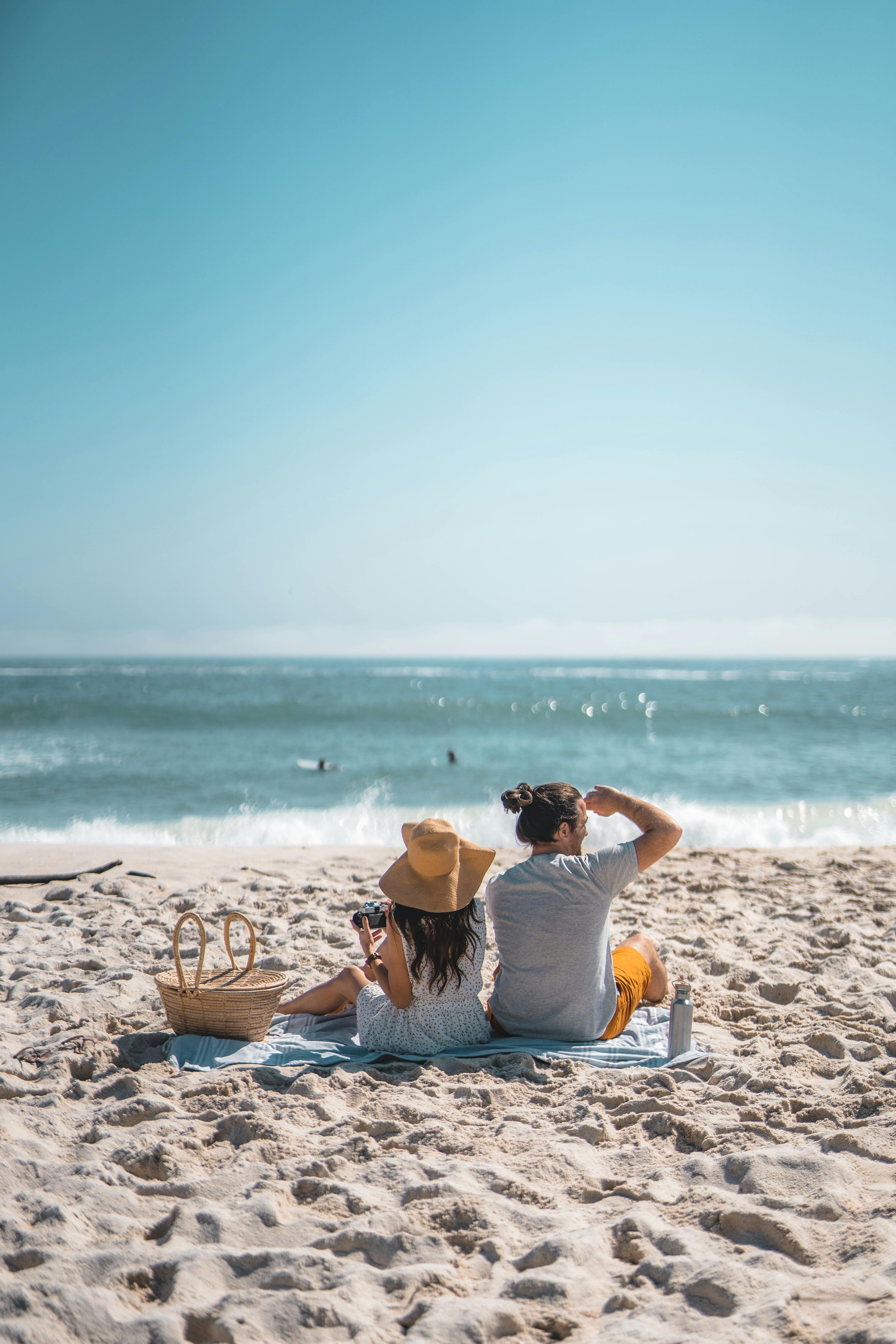 a couple relaxing at the beach