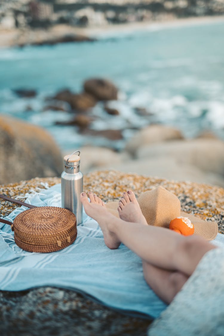 Shallow Focus Photo Of A Woman Having A Picnic At The Beach