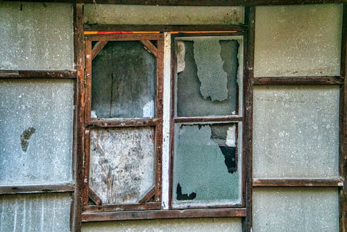 An Old Brown Wooden Framed Window