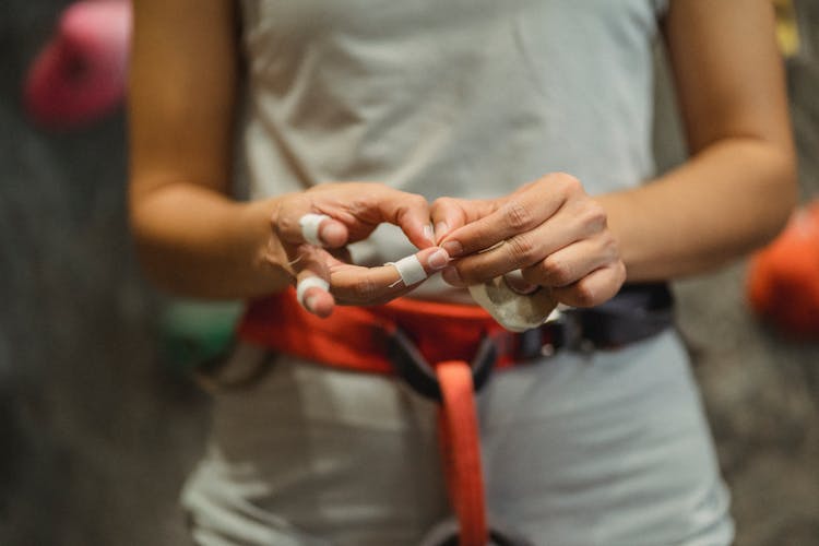 Crop Alpinist With Safety Belt Preparing For Training