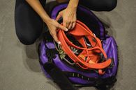 Crop climber with sports equipment on floor