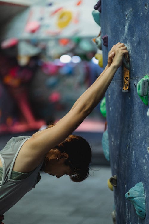 Free Climber preparing for training in gym Stock Photo