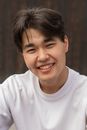 Handsome young ethnic guy looking at camera and smiling