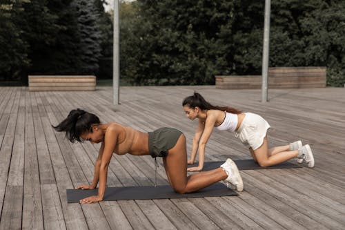 Free Fit women practicing Box pose together in nature Stock Photo