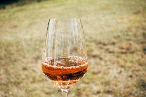Free Close-Up Photo of a Brown Liquor in a Wine Glass Stock Photo