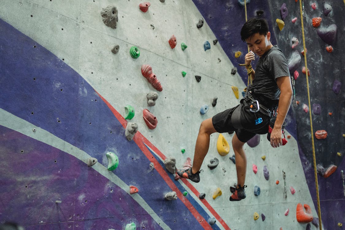 Alpinist training  in climbing gym