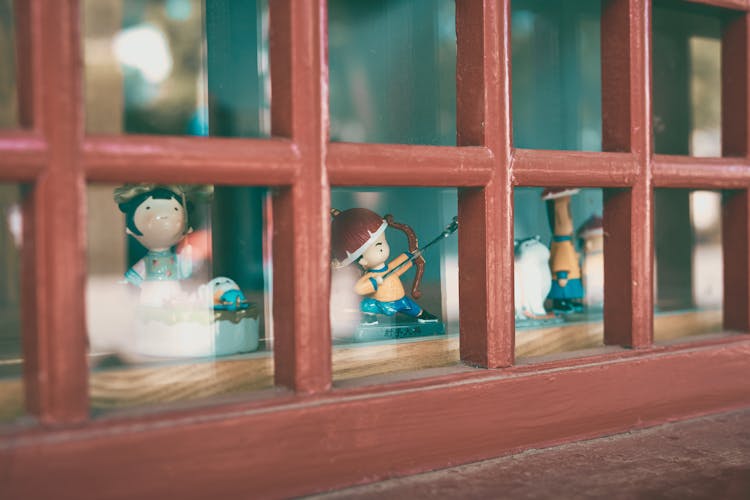 Tiny Figurines On Windowsill