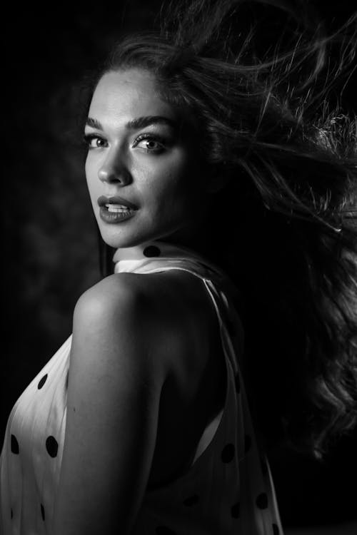 Woman Posing with Her Hair Blowing in the Wind 