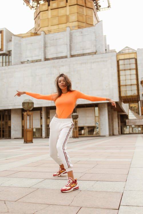 Brunette Woman Dancing with Messy Hair 