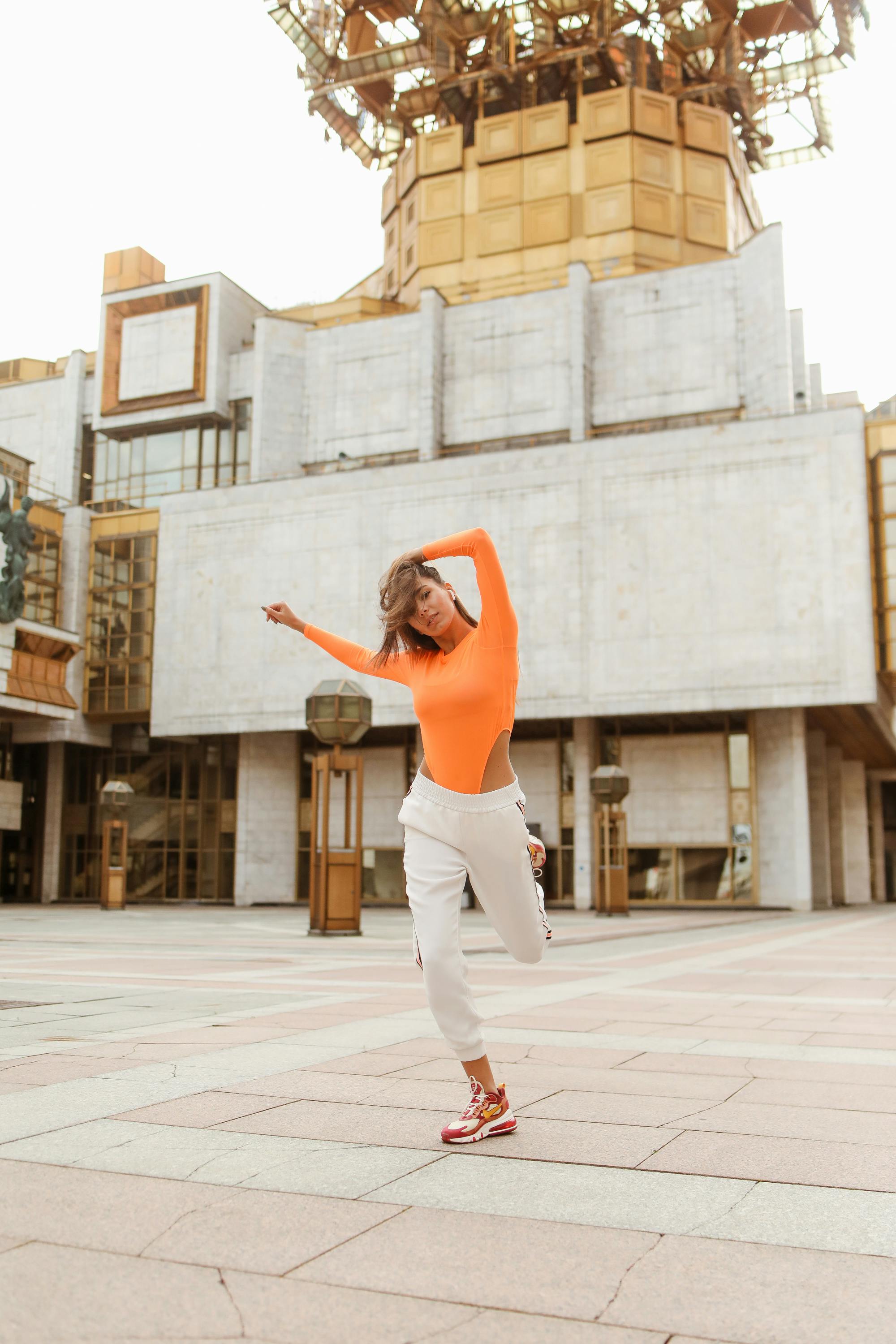 woman dancing while holding her hair