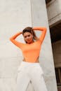 Pretty Woman in Orange Long Sleeve Shirt and White Pants · Free