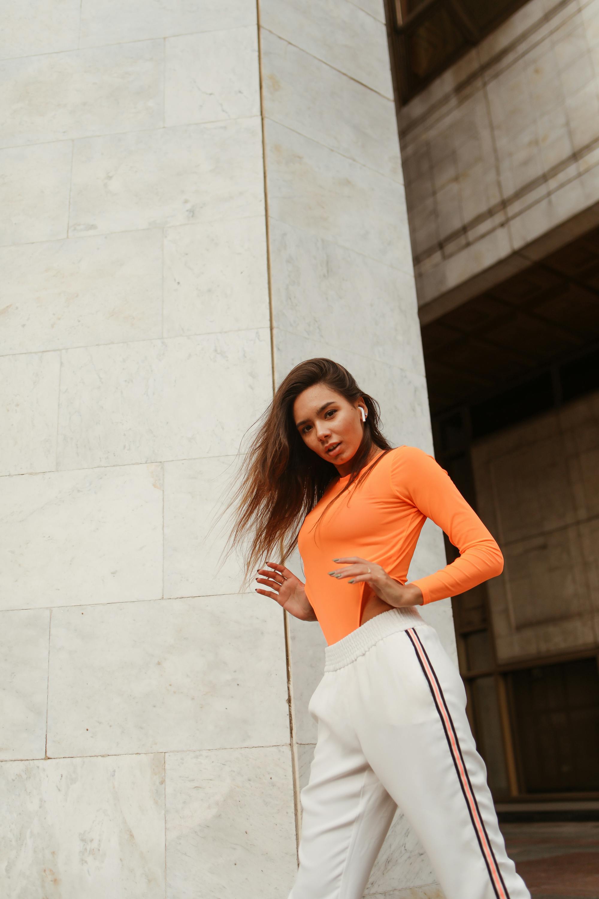 Pretty Woman in Orange Long Sleeve Shirt and White Pants · Free