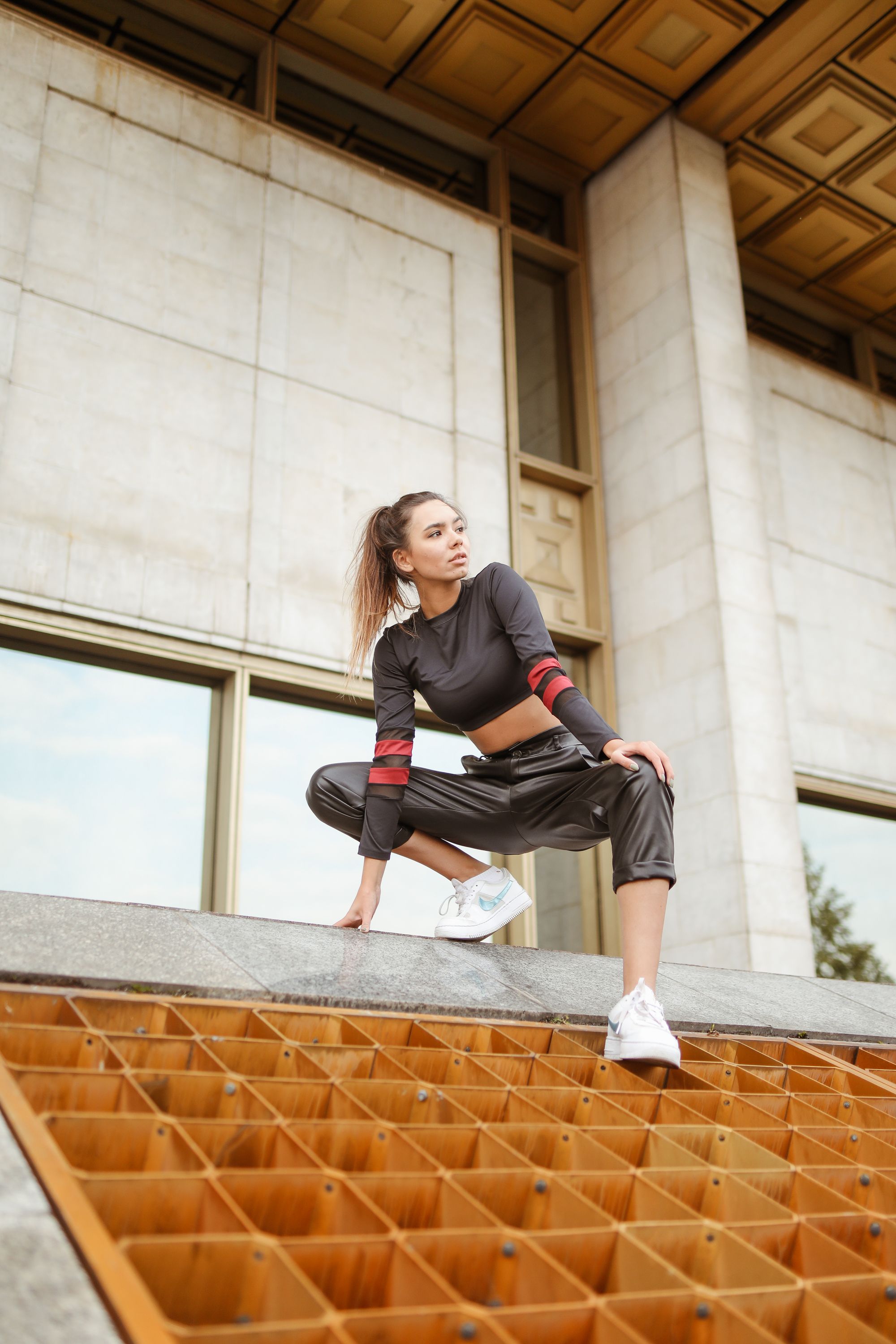 woman wearing track pants and fitted tshirt sporty casual