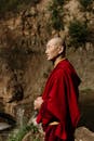 Monk Holding a Prayer Beads while Looking Afar