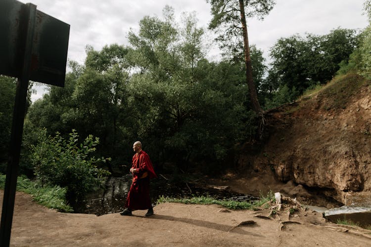 A Monk Walking In The Forest 