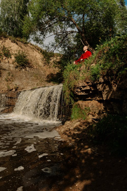 Monk during Meditation over River in Summer