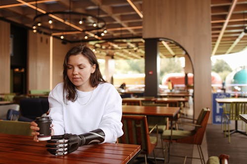 A Woman Holding a Coffee Cup 