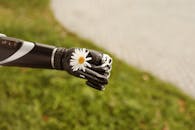 Prosthetic Arm Holding Daisy Flower