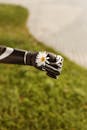 Prosthetic Arm Holding Chamomile