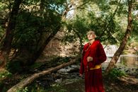 Woman in Red Dress Standing Near Tree