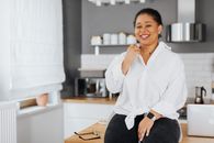 Smiling Woman Sitting on Table