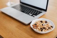 Macbook Pro on Brown Wooden Table