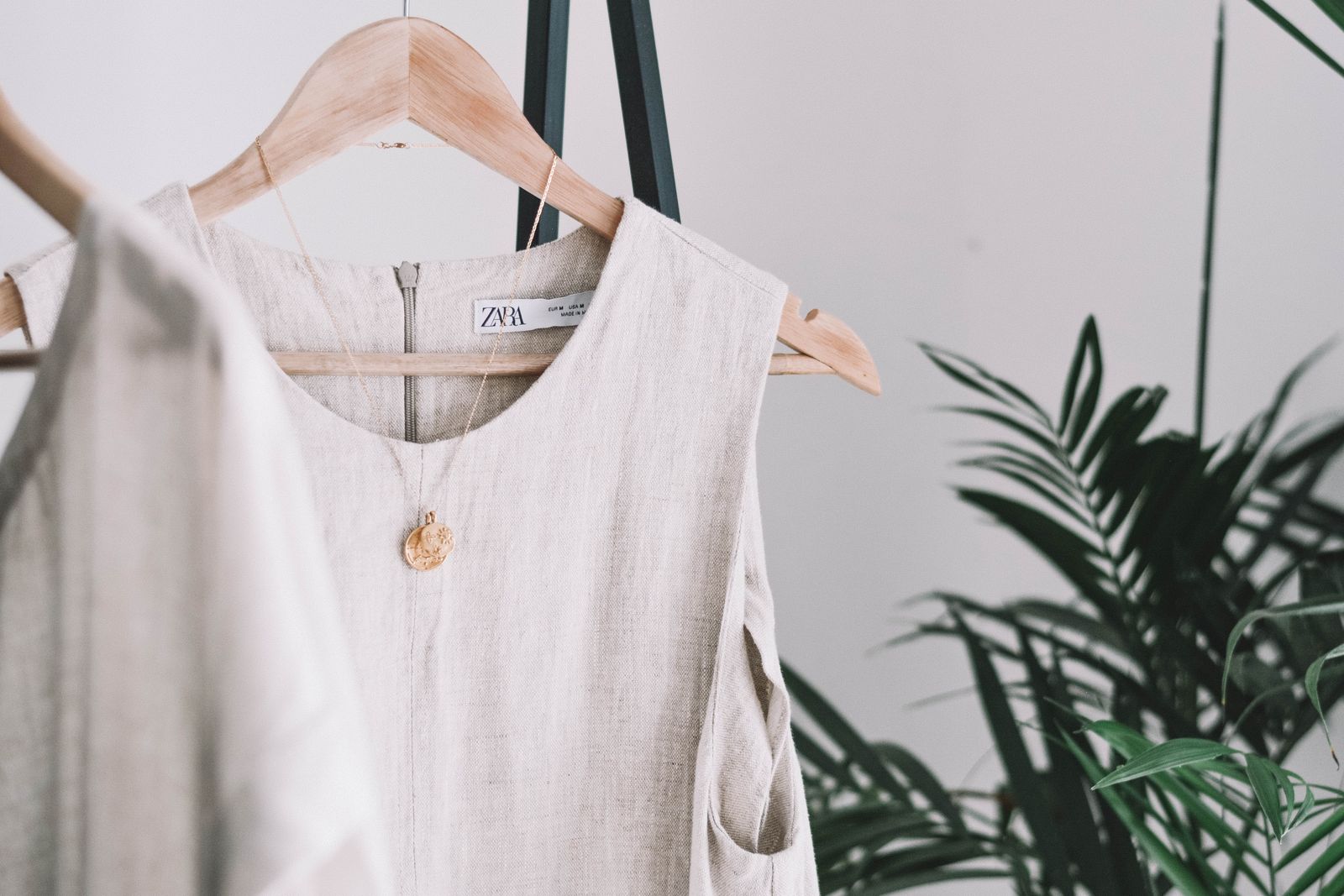 Minimalist beige dress in natural setting