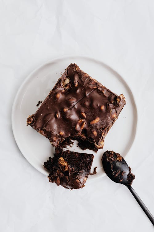 Slice of Chocolate Brownie on White Ceramic Plate