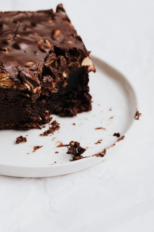 Free Chocolate Brownie on White Ceramic Plate Stock Photo