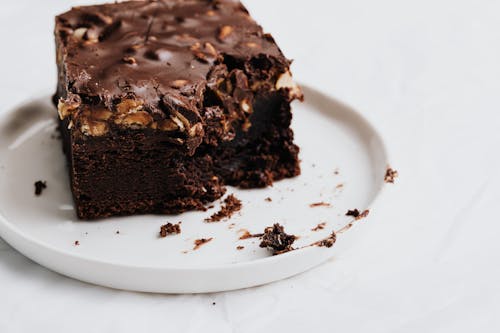 Free Chocolate Brownie on White Ceramic Plate Stock Photo