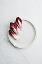 White and Pink Flower Petals on White Round Plate