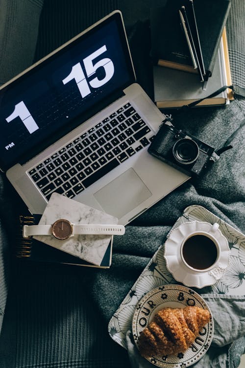 Free Croissant Beside the Gray Laptop Stock Photo