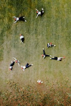 Drone view of female in multiple exposure enjoying nature while resting in green park in various postures