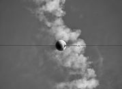 White Round Ball on Black Wire Under White Clouds