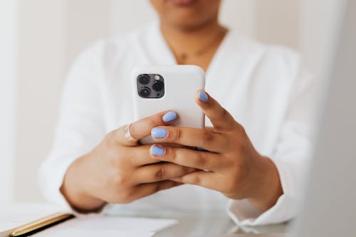 Close-Up View of a Person Using an Iphone