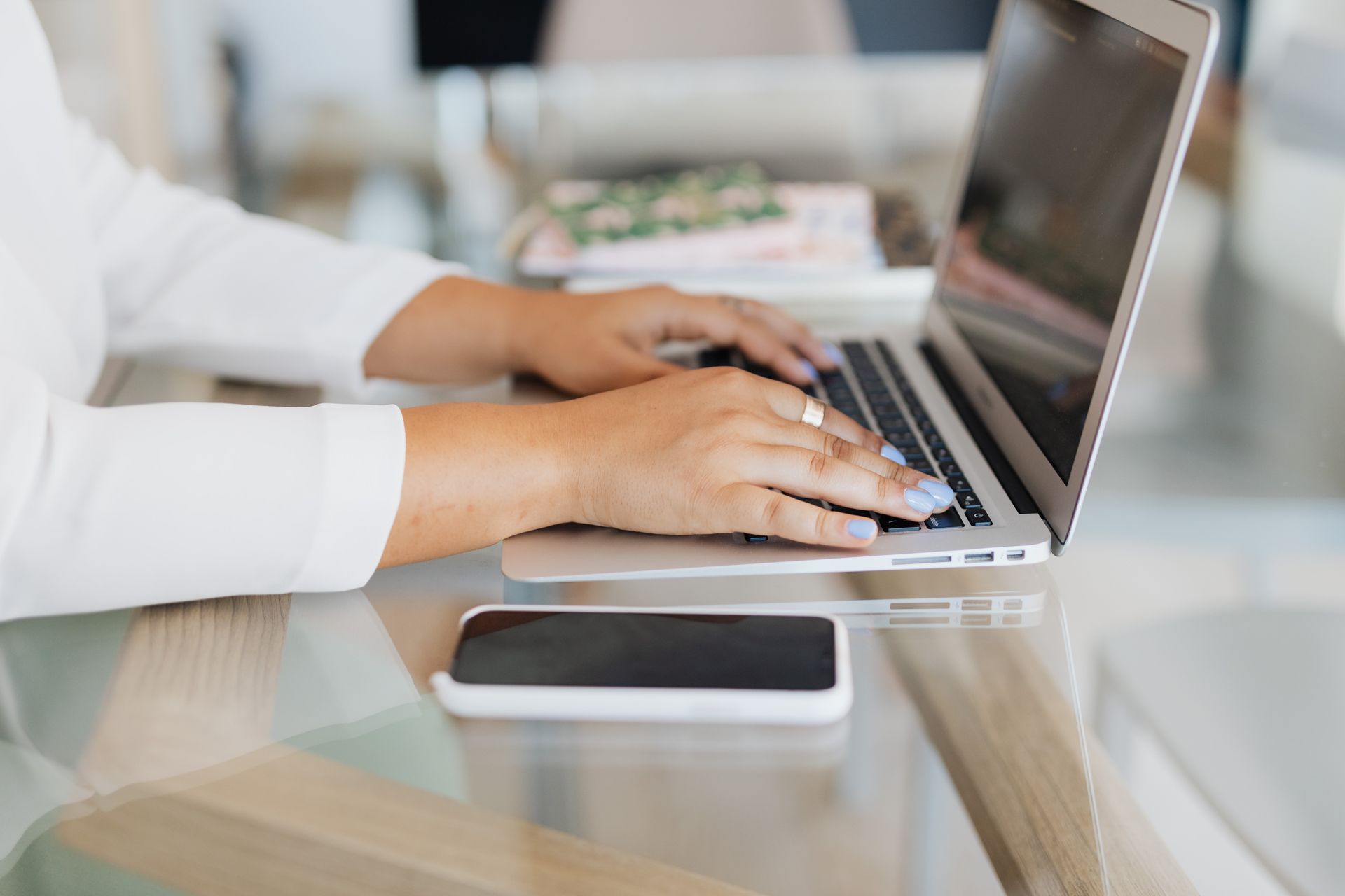 Person Typing on Laptop