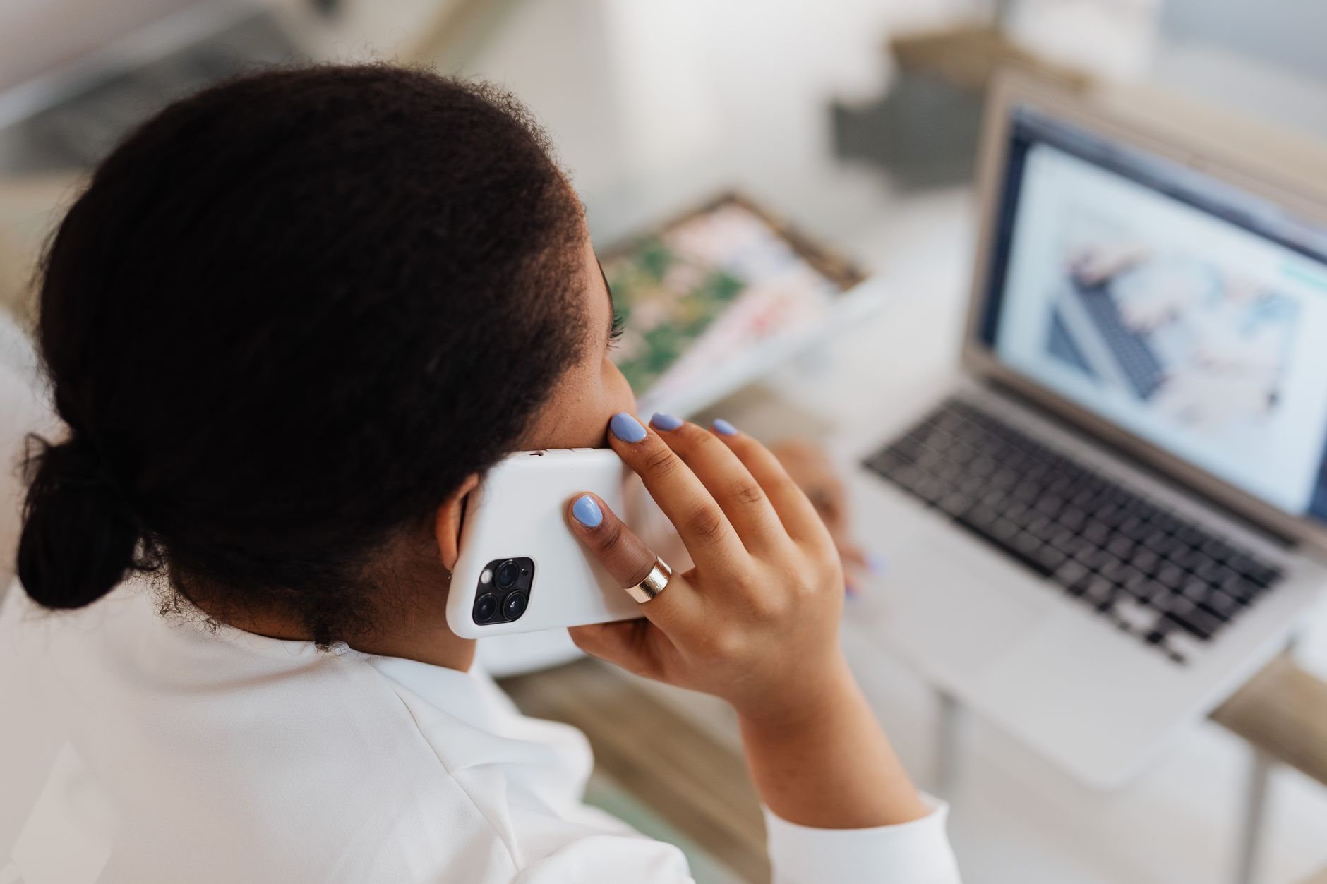 Loan officer reviewing mortgage applications on laptop