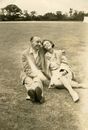 Elderly Couple Sitting on Grass Field