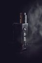 Black Box Mod Vaporizer on Black Textile