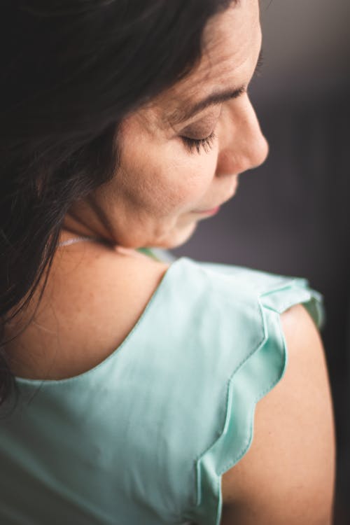 Woman in Teal Sleeveless Shirt