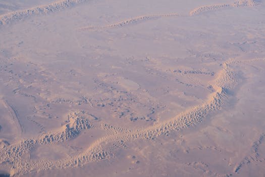 Stunning aerial capture of Al Wahat Al Dakhla Desert's expansive dunes in Egypt.